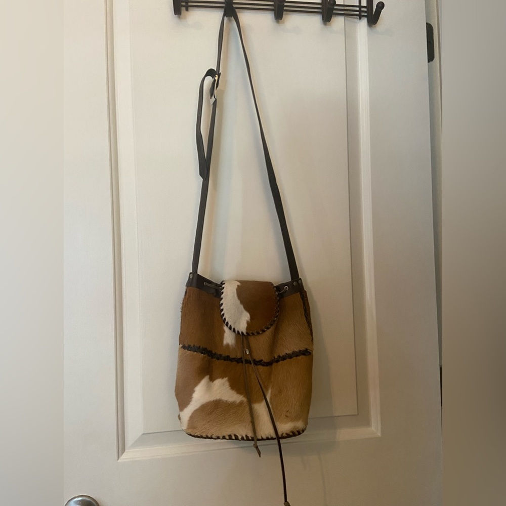 100% authentic cowhide handmade purse with long strap.